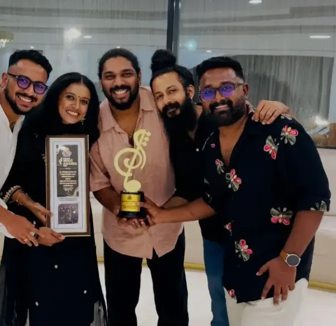 The band members with the award