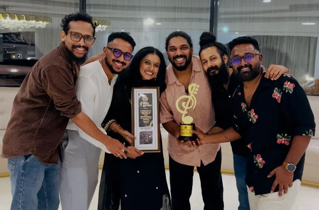 The band members with the award